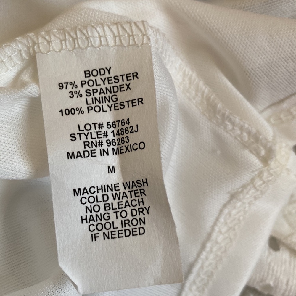 NEW W/ TAGS. Cute eyelet dress/attached liner. Flutter sleeves/ruffle hem. Med - Picture 4 of 6
